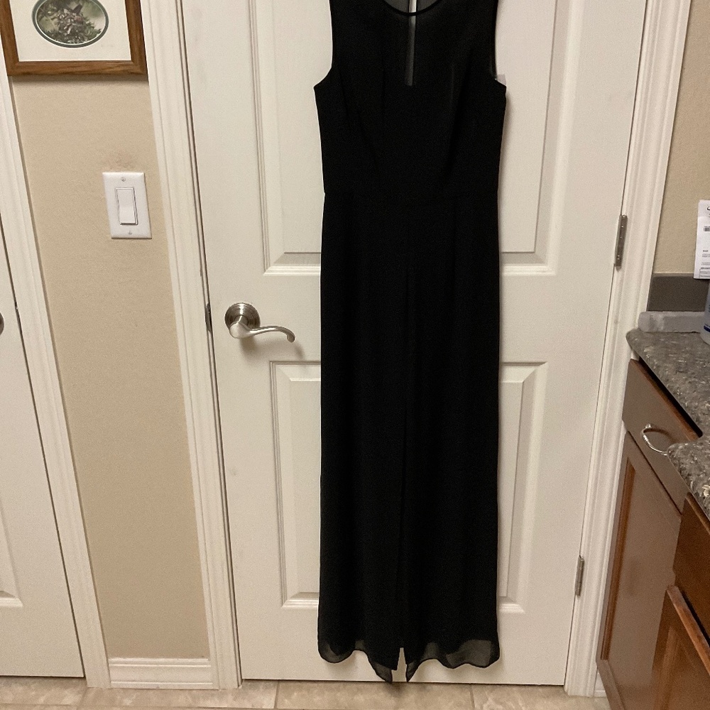 Antonio Melani size 0.  NWT.  Black pantsuit.  Fabric with sheer overlay.